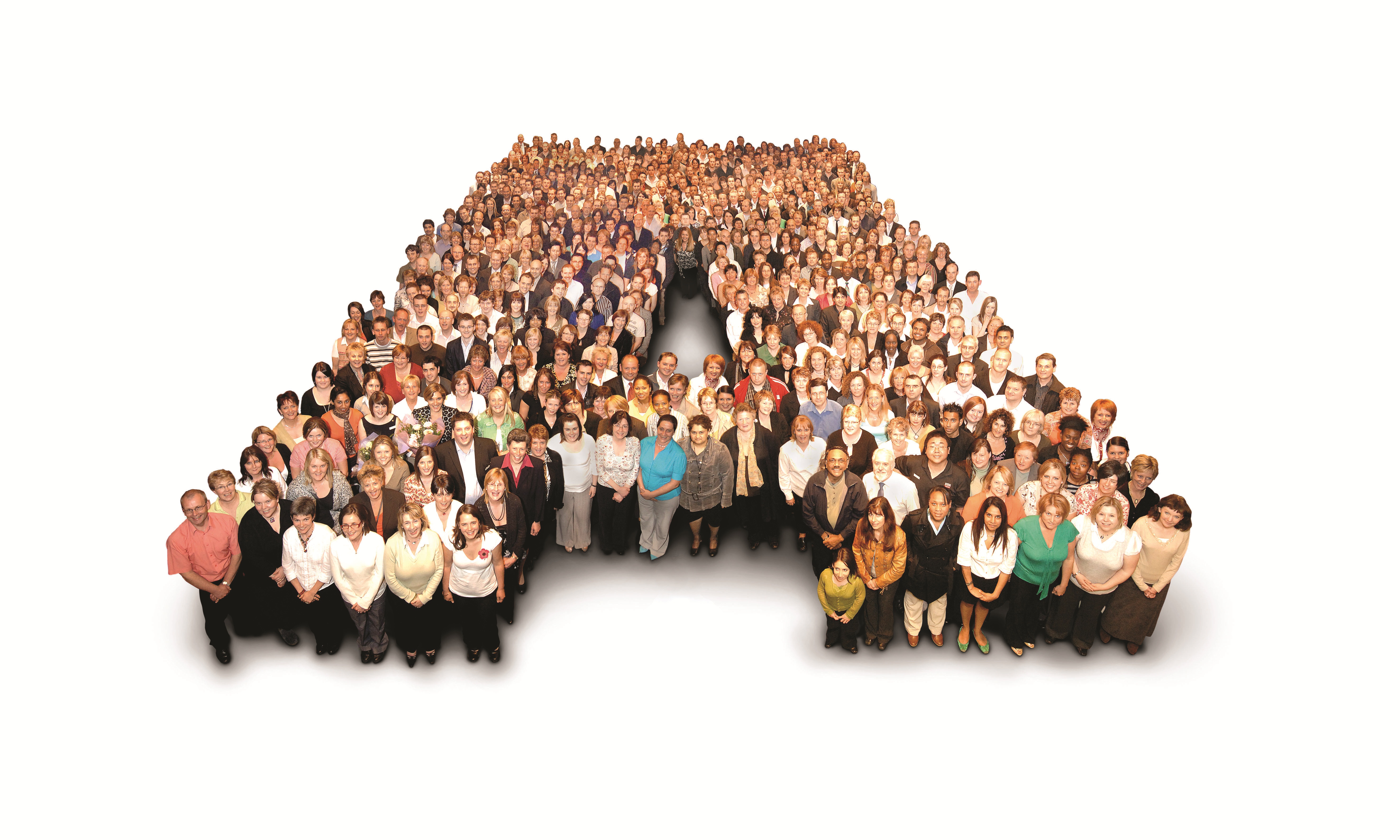 A large group of people forms the letter "A" against a white background. The diverse crowd is smiling, conveying unity and a positive, collaborative atmosphere.