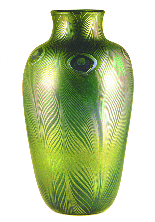 Colour photograph showing a greeny-yellow vase which broadens from the base and then narrows at the neck.  The decoration motif is peacock feathers