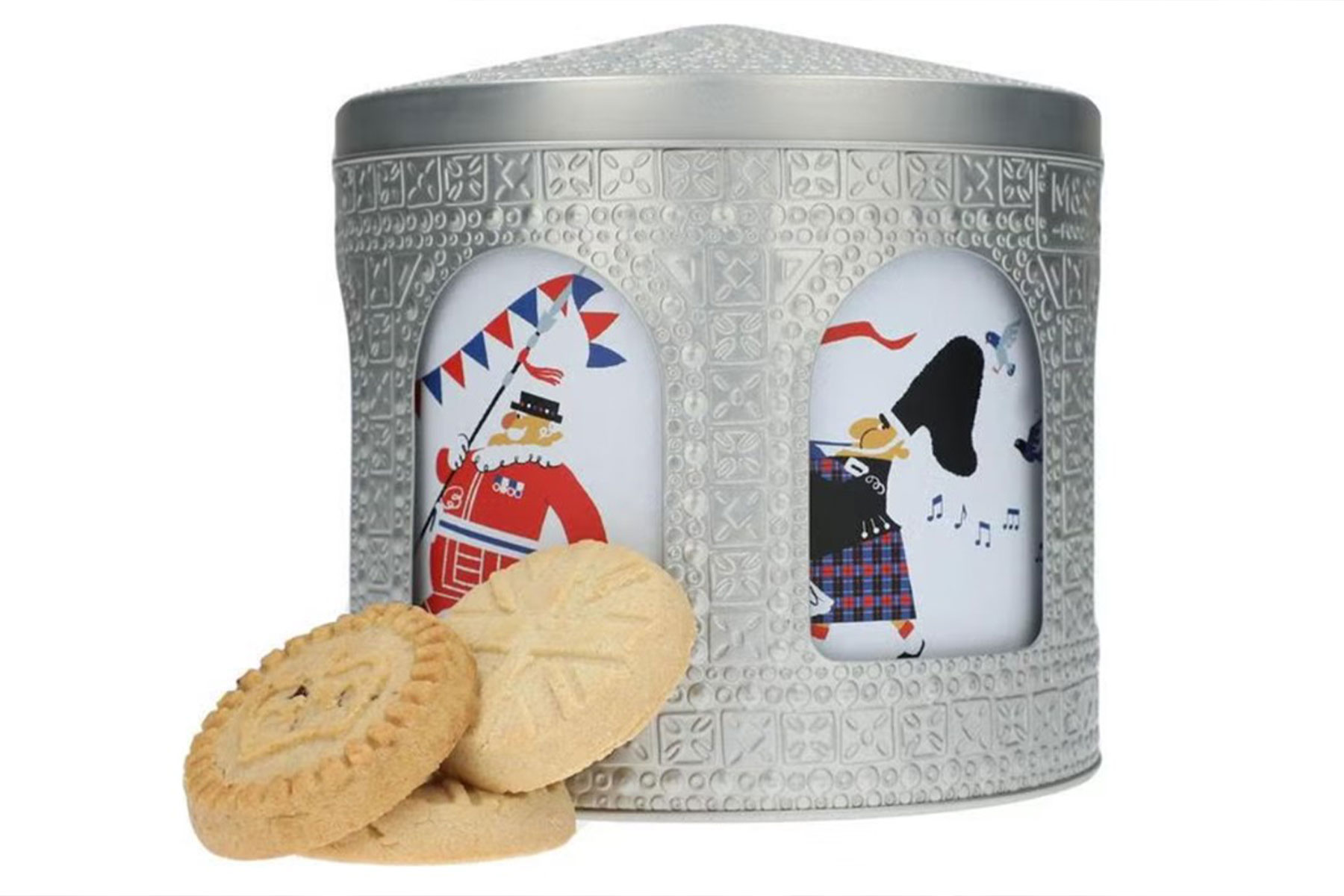 Biscuit tin in a cylinder shape with archways cut out and images inside.