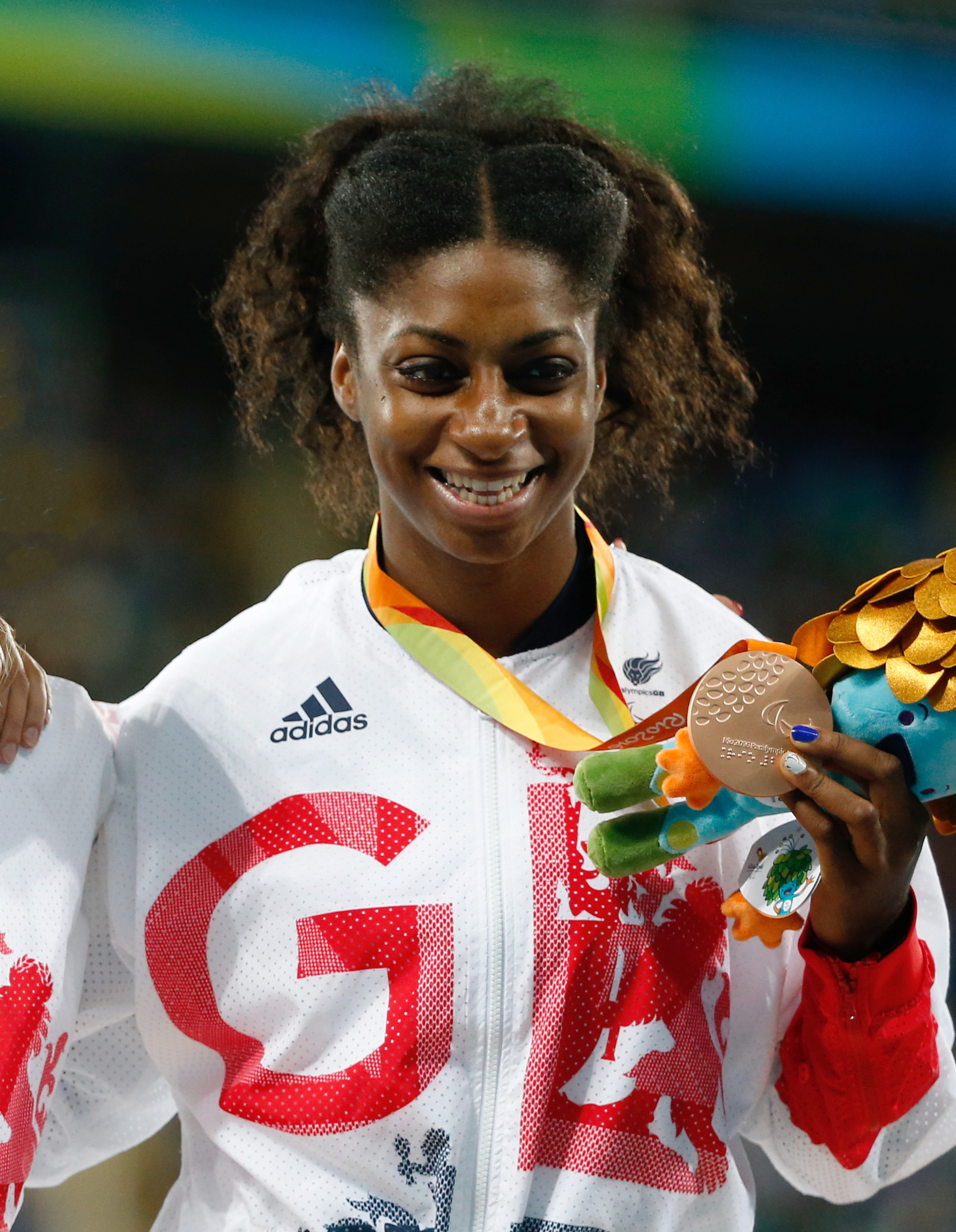 Colour photograph showing Kadeena at the 2016 Paralympics, on the podium for her bronze medal.