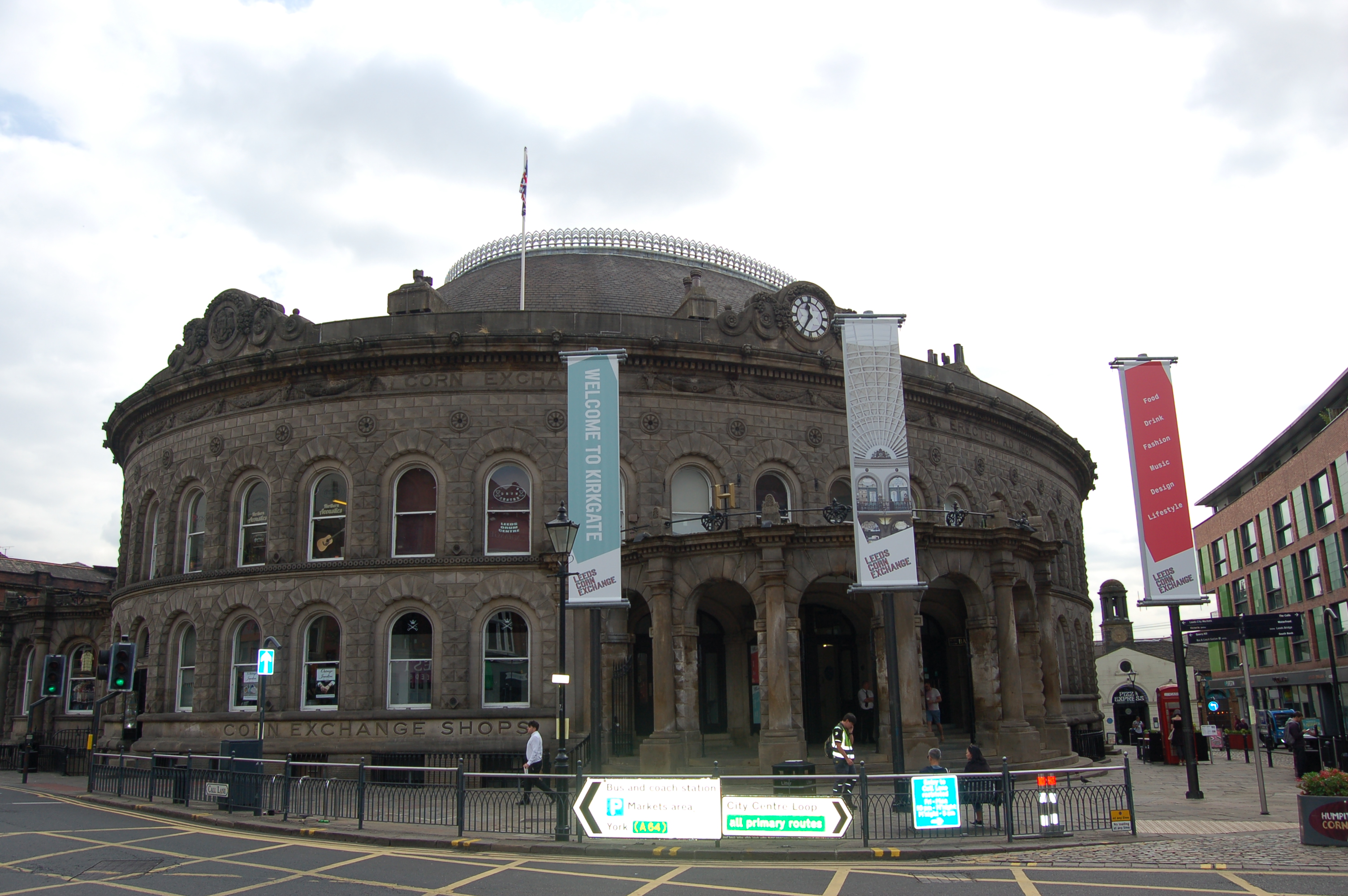 Contemporary photograph of the outside of the Corn Exchange, which is a round shaped building with a domed roof.