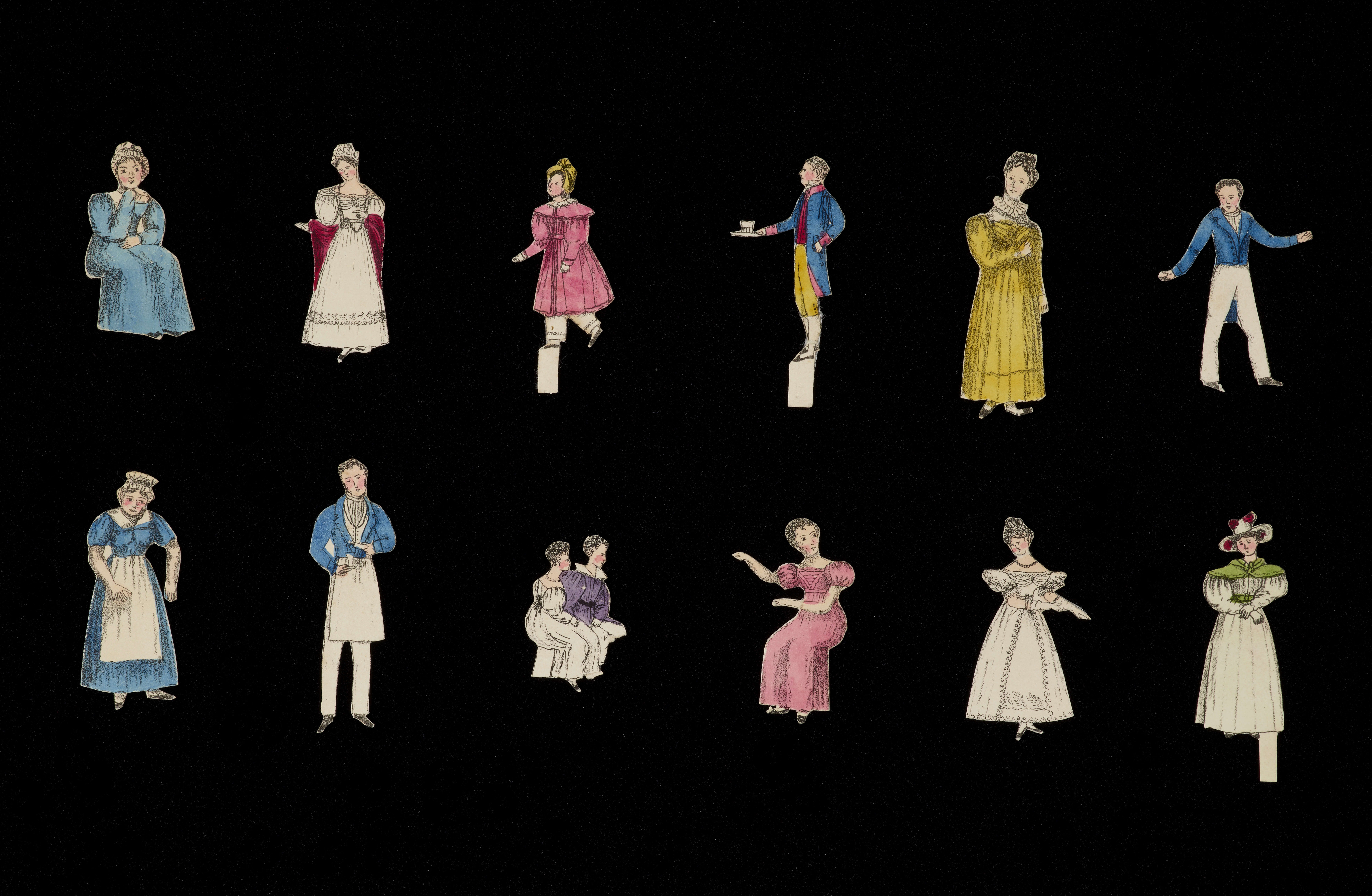 A selection of cut out cardboard figures of people, from women in rich dresses, to butlers and maids