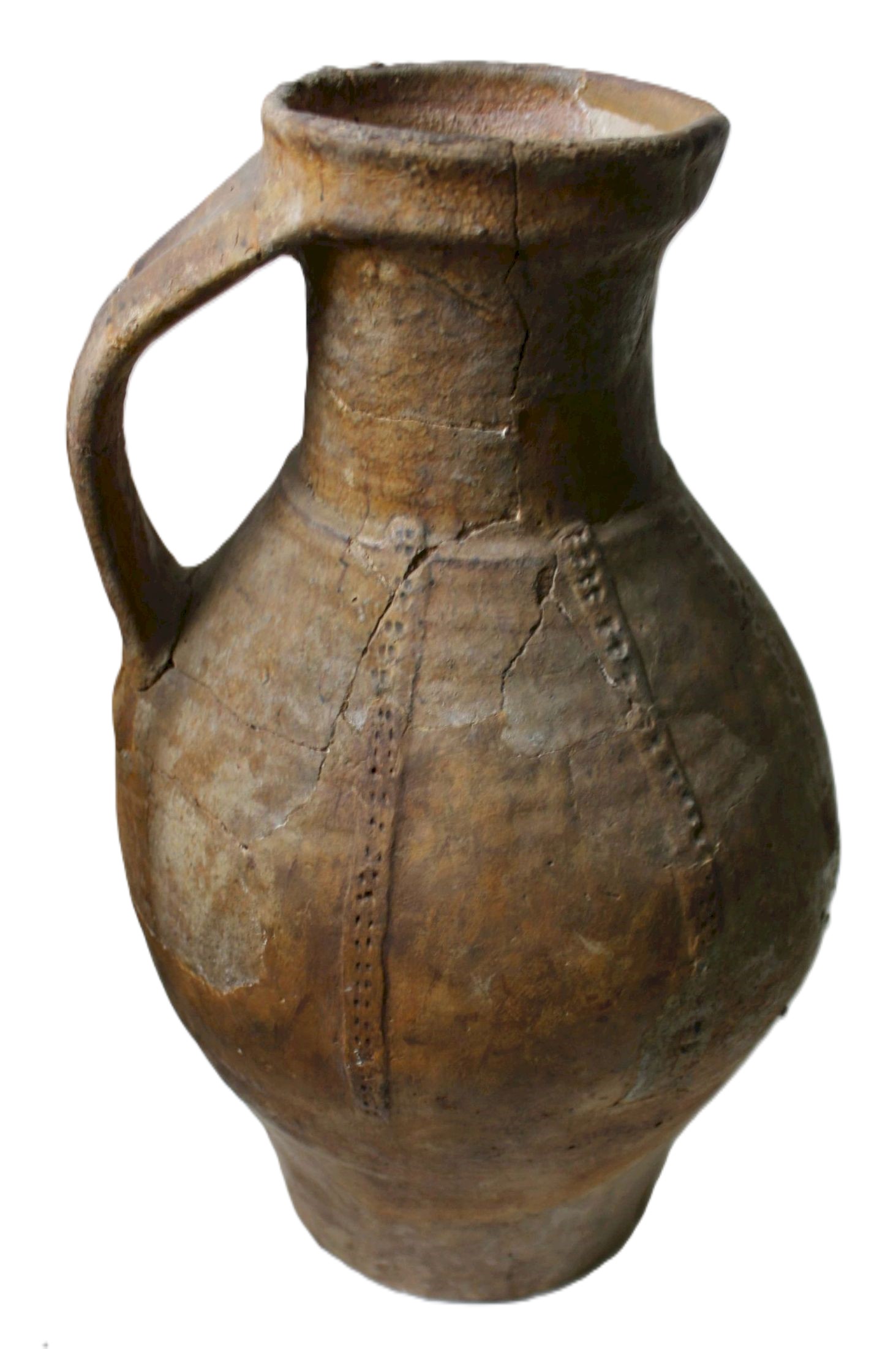 An ancient, weathered clay jug with a curved handle and visible cracks. The surface is textured and earthy brown.
