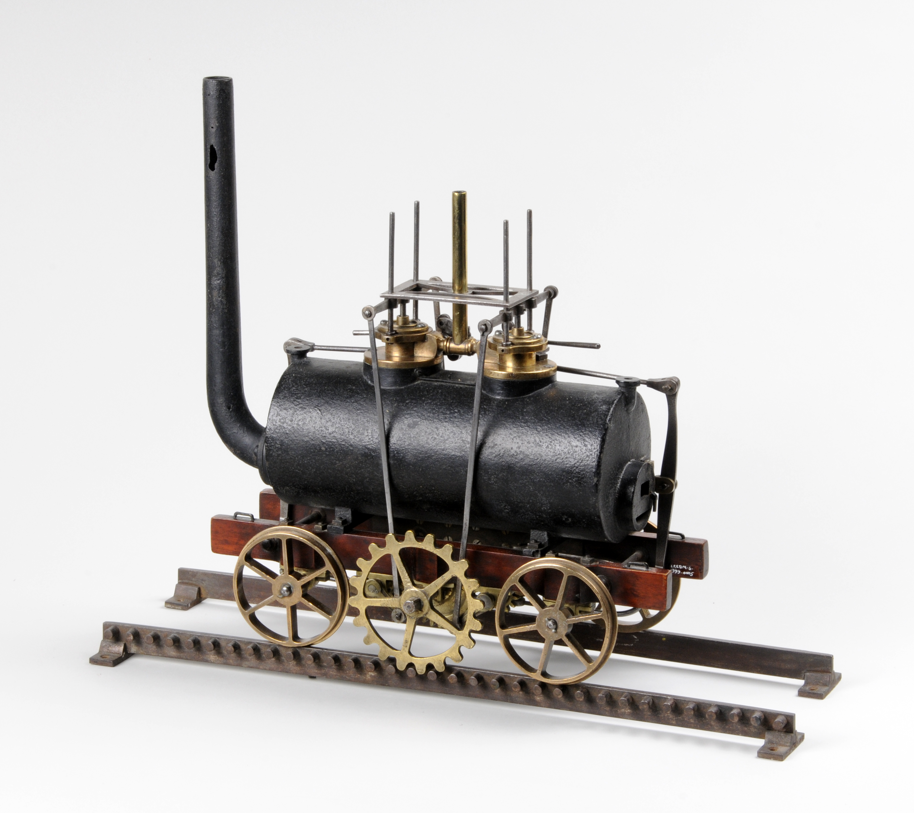 Cast iron,  wood and brass model of a locomotive, 45 cm long