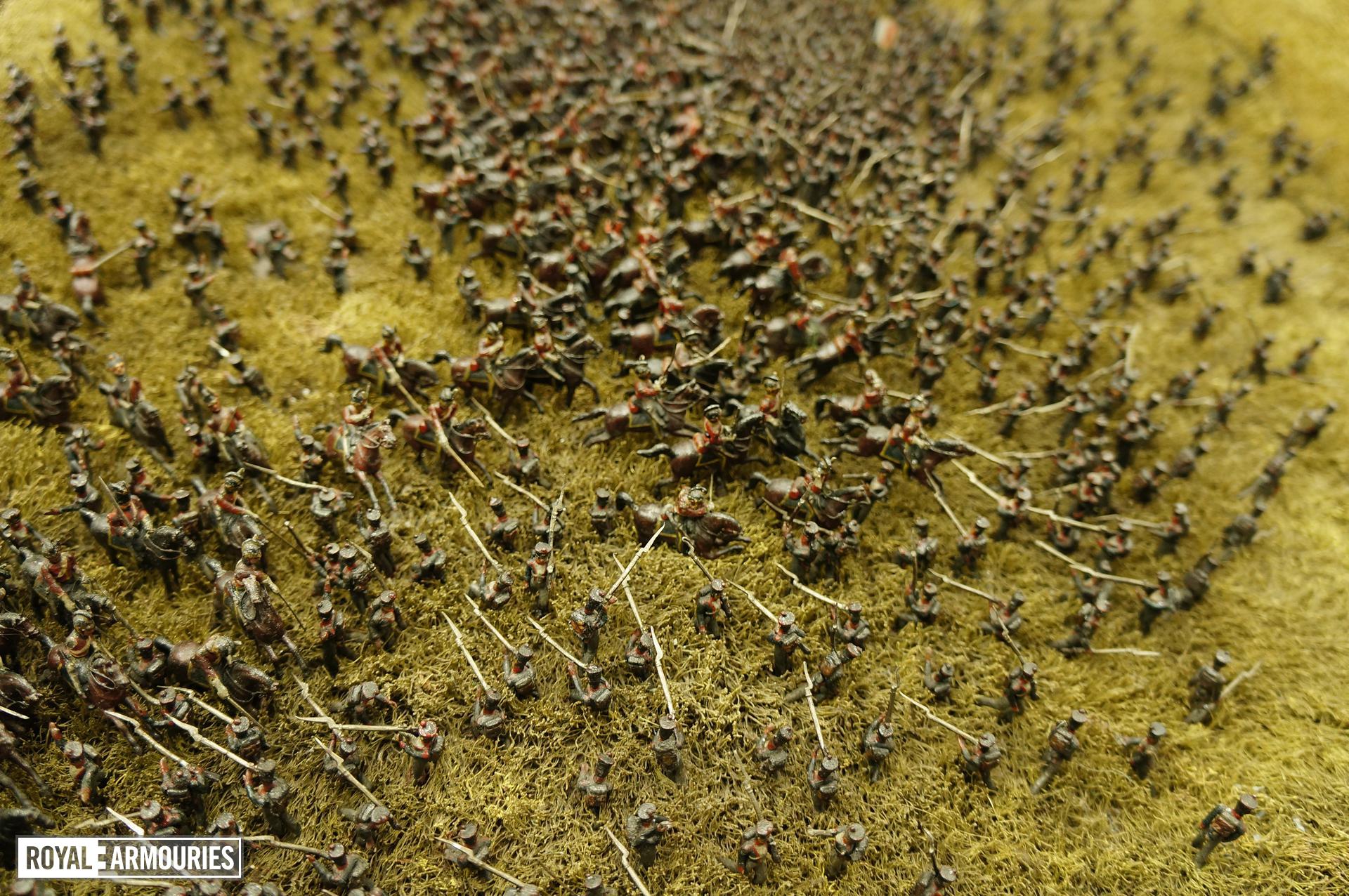 Colour photograph taken from above the model, showing many model soldiers positioned as if fighting