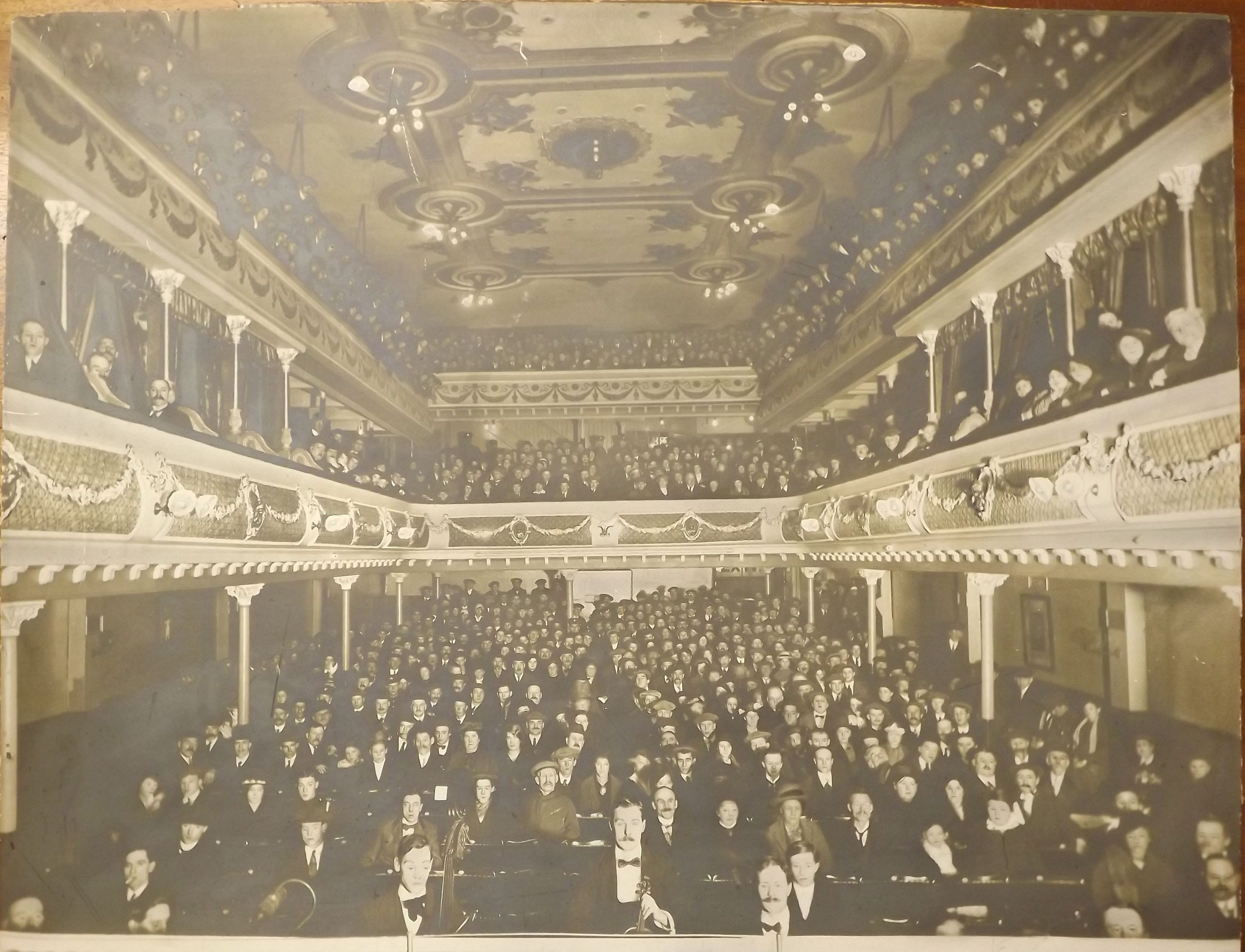 View from City Varieties stage showing a packed audience in the seats and both balconies