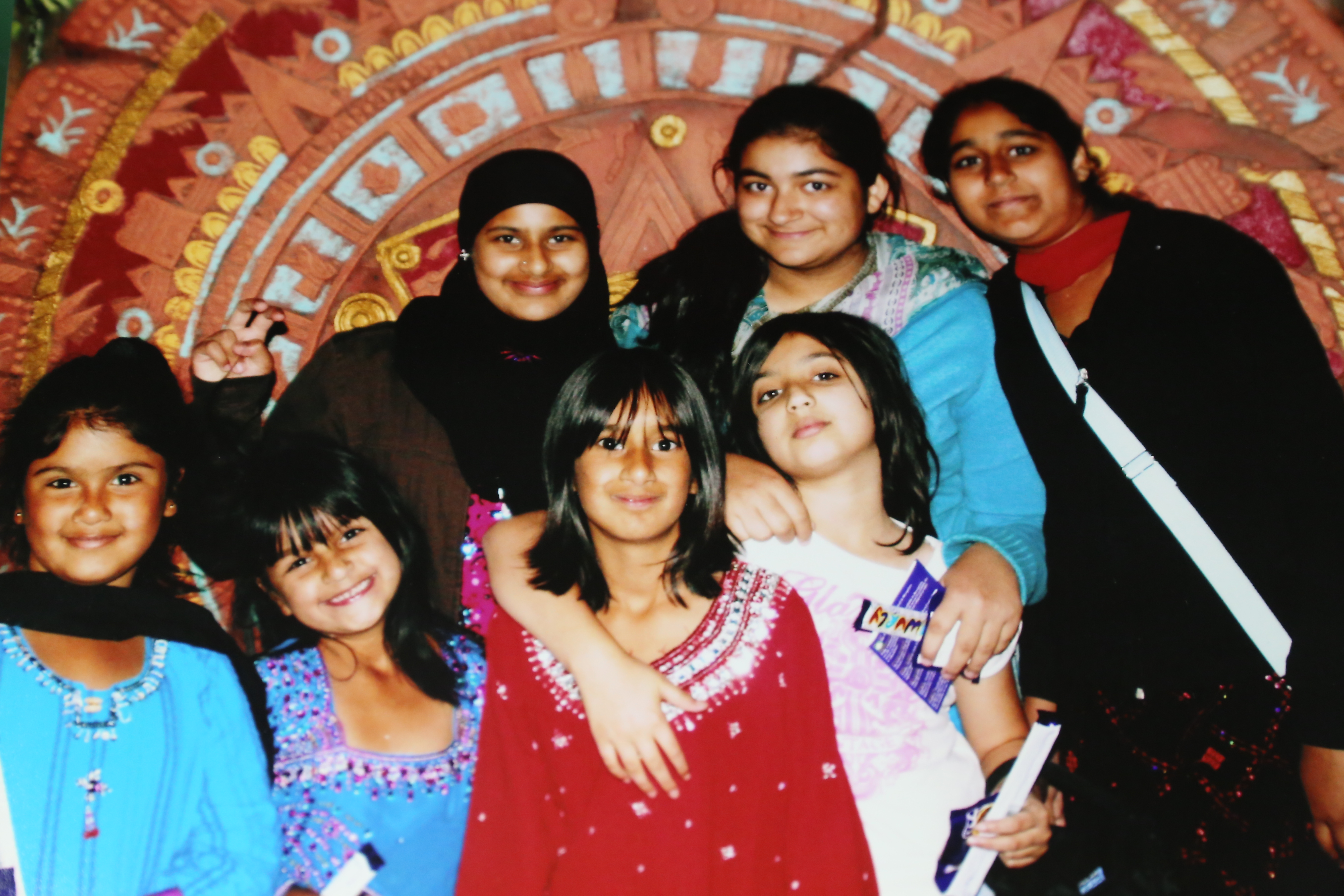 Colour photograph showing a group of 7 girls of varying ages