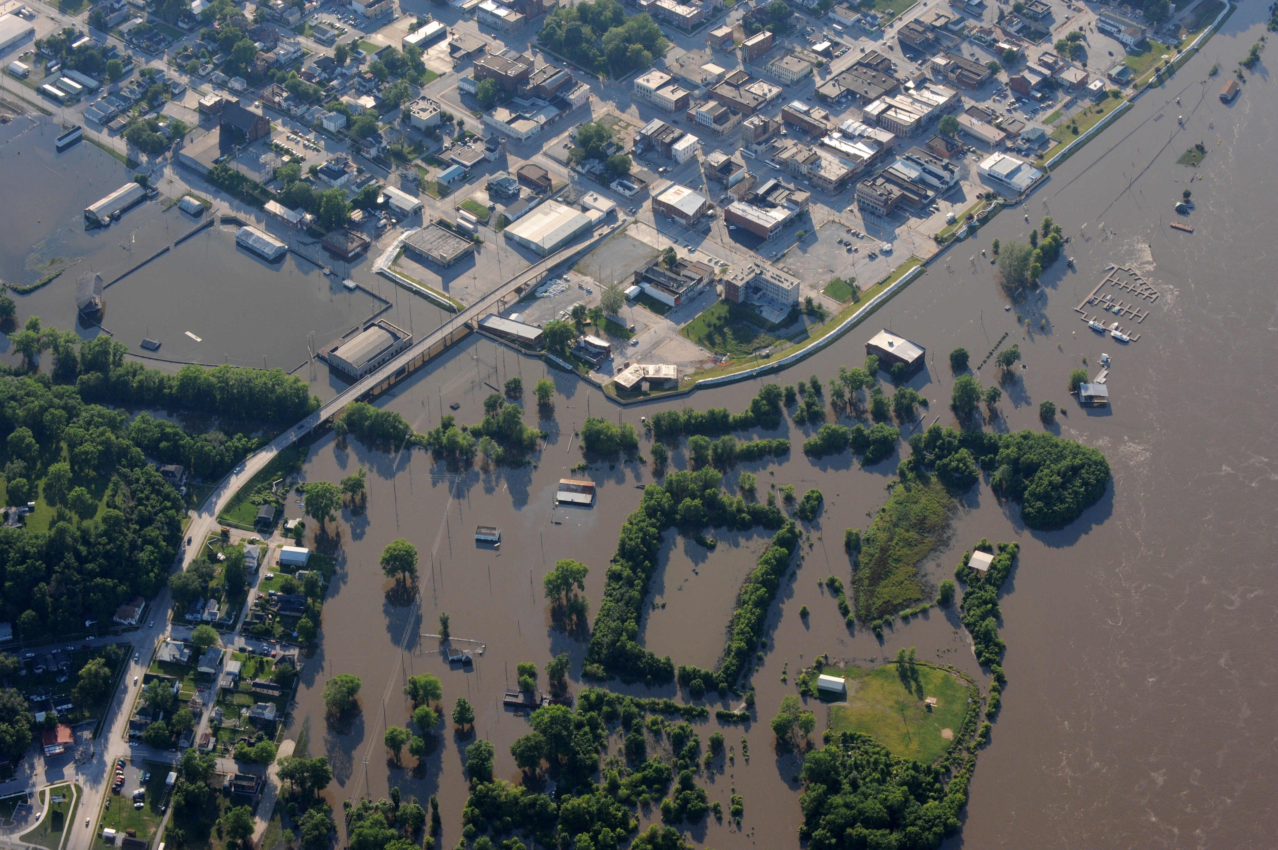 Colour photograph showing an aerial view of a town with large sections completely underwater