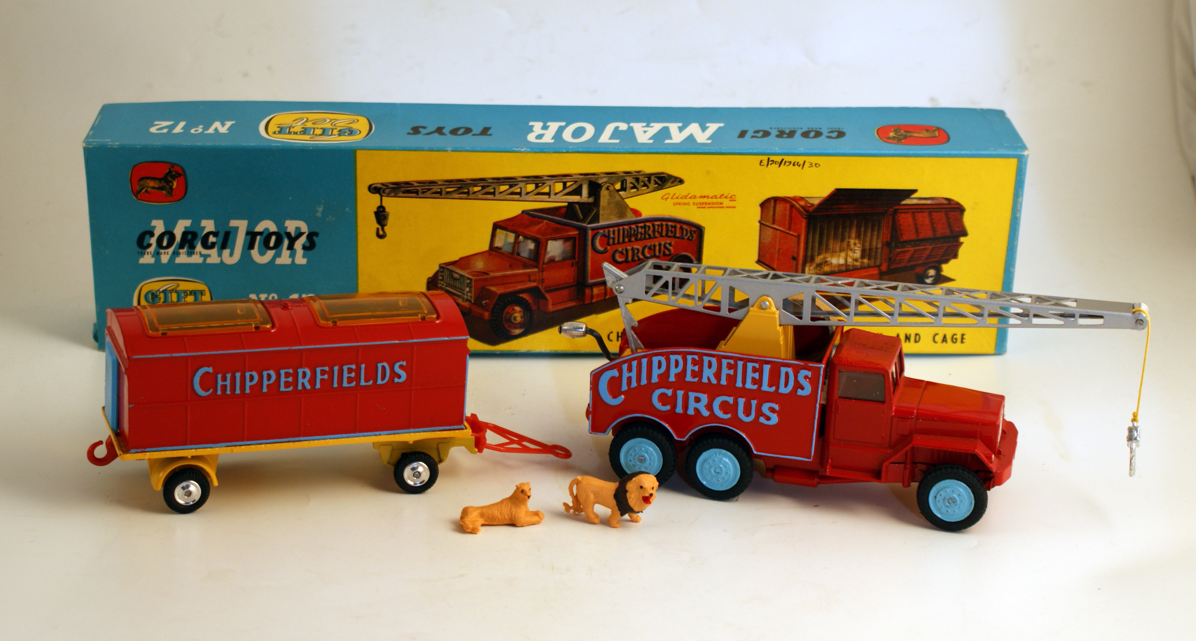 Red Chipperfield circus crane and trailer with two small plastic lions