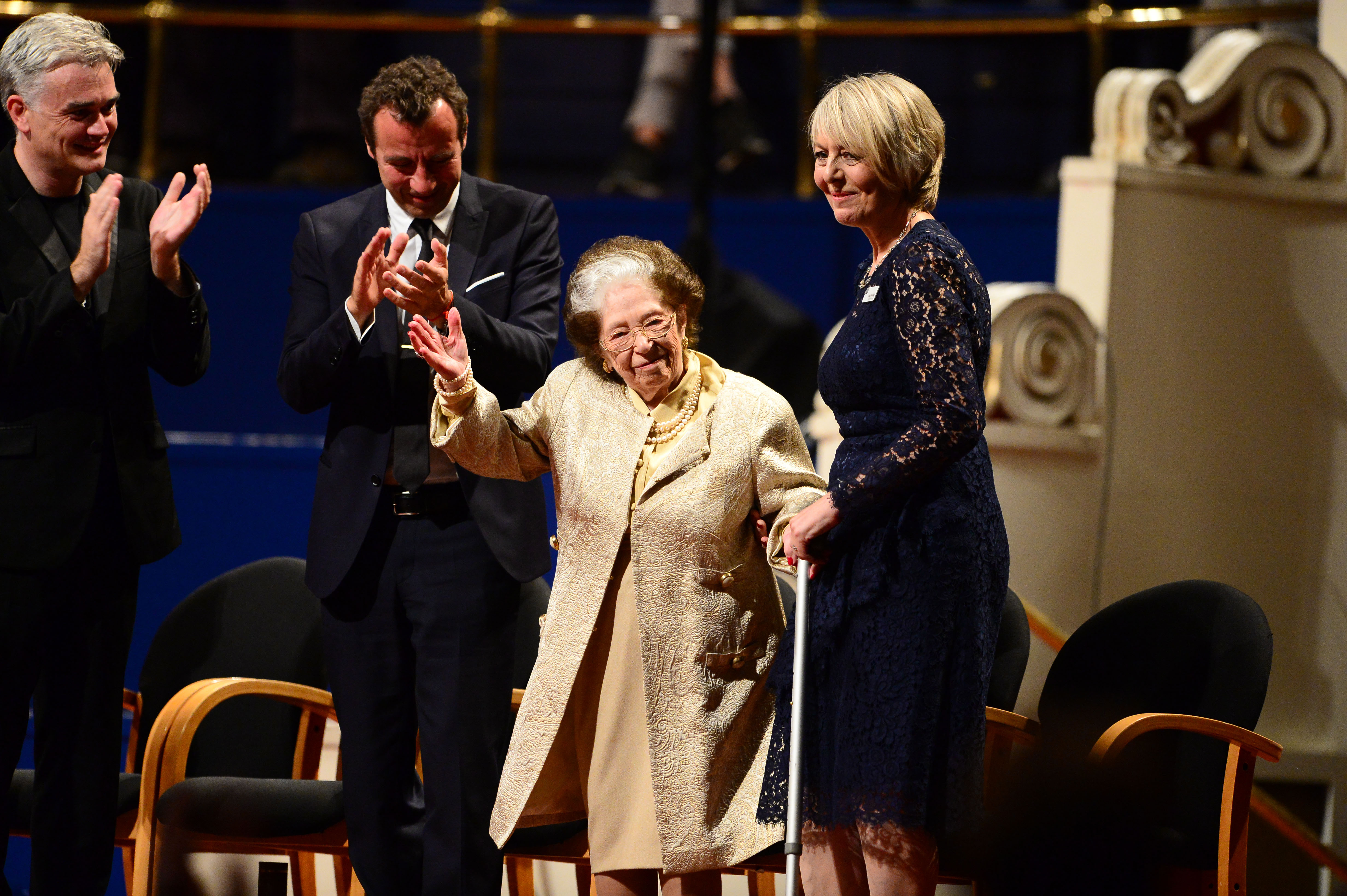 colour photograph showing Dame Fanny in the centre, receiving applause.