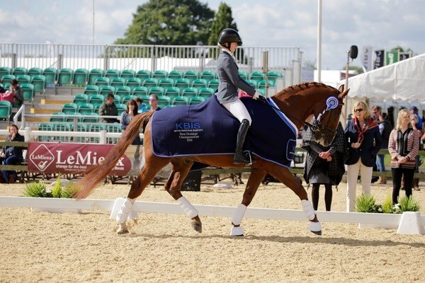 Colour photograph of Izzy on her horse