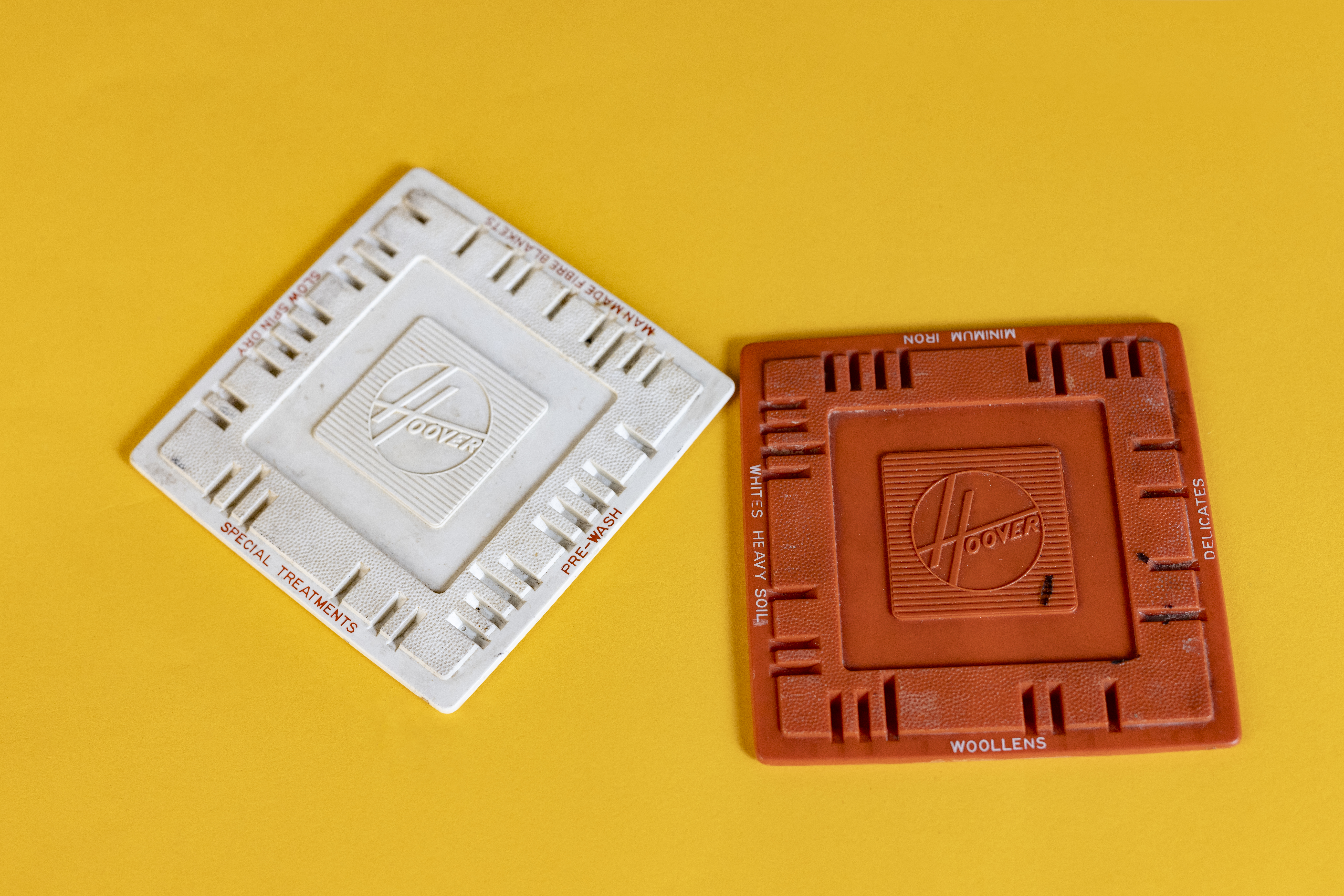 Two plastic disks inserted into washing machines to set the desired programme.