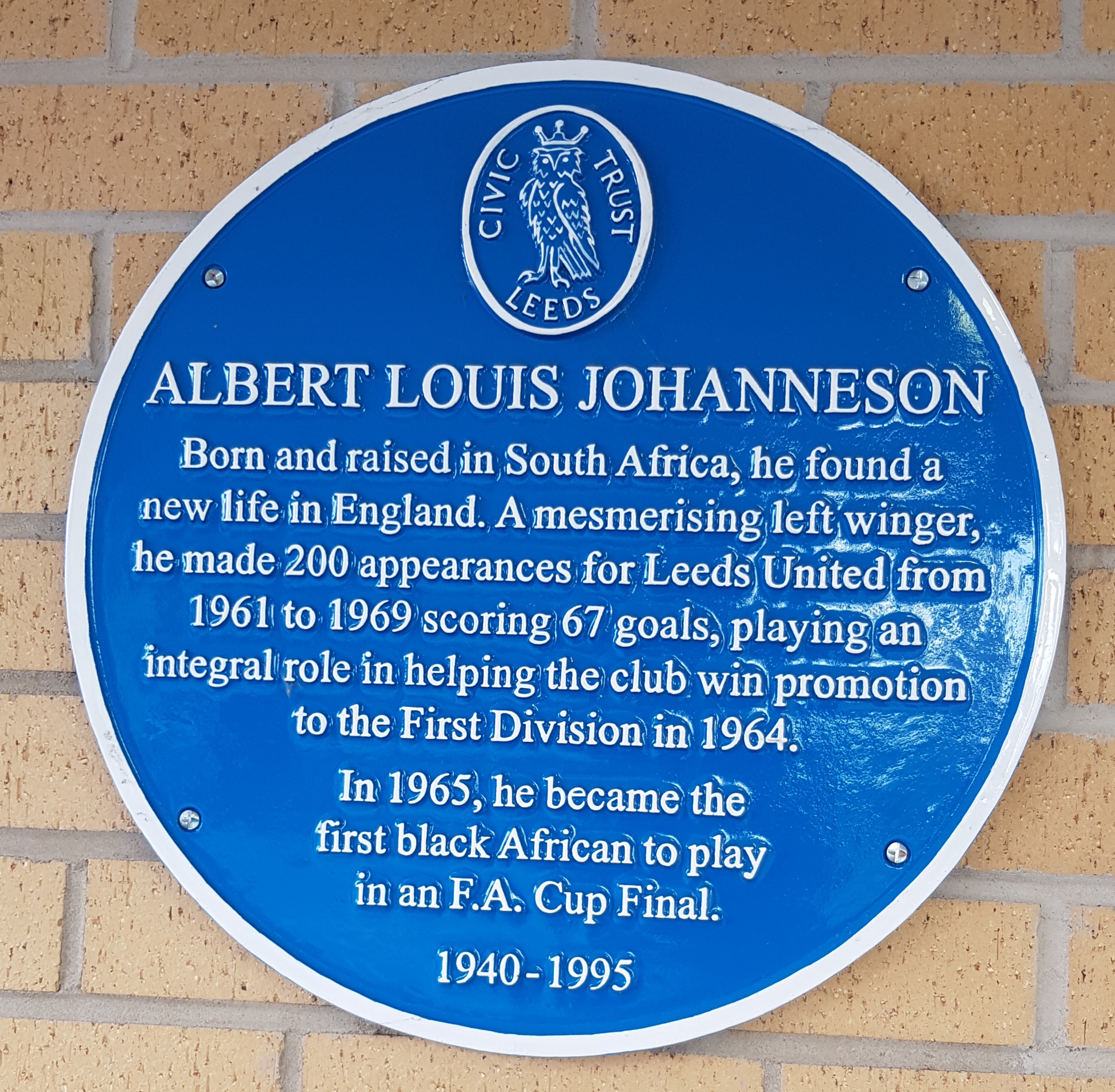 Colour photograph of a blue plaque