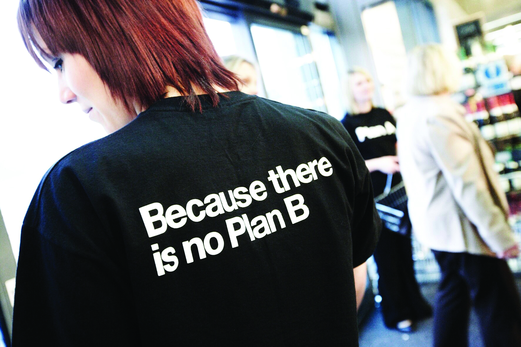 Photograph showing an M&S employee wearing a 'no plan b' t-shirt