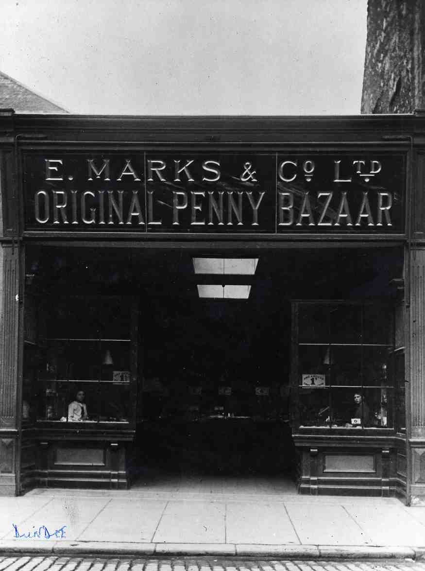 Black and white photo of a shop frontage with lettered signage E.Marks & Co Ltd Original Penny Bazaar