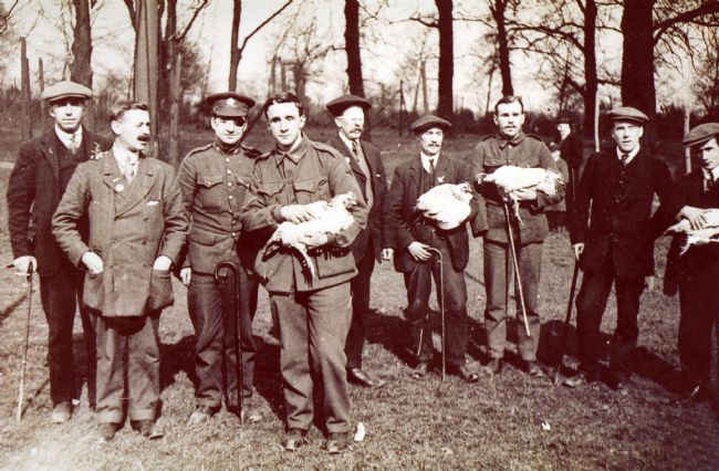 Group photograph of blinded soldiers undertaking poultry farming training with St Dunstan's (now Blind Veterans UK)