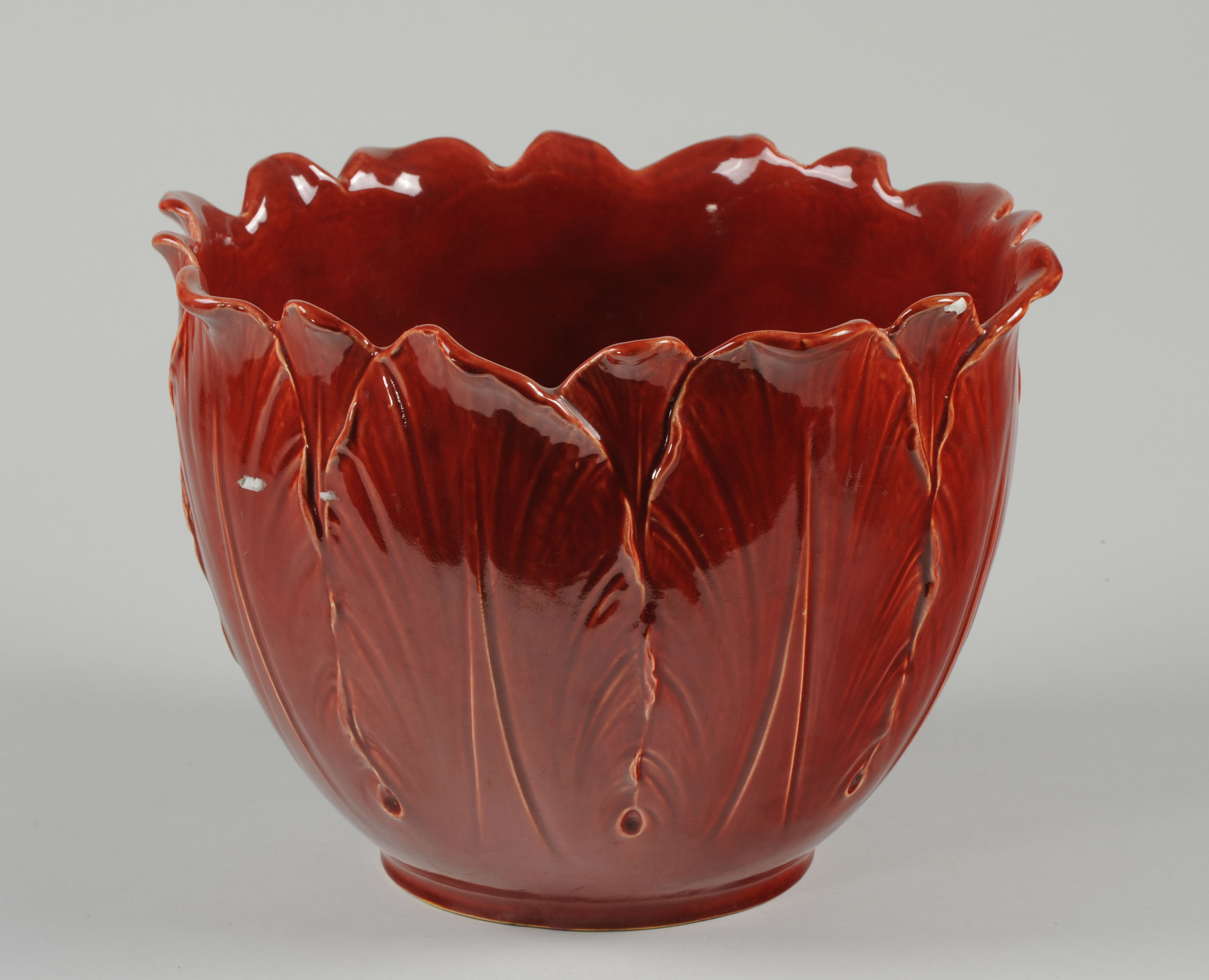 Red glazed pot in the shape of a cabbage