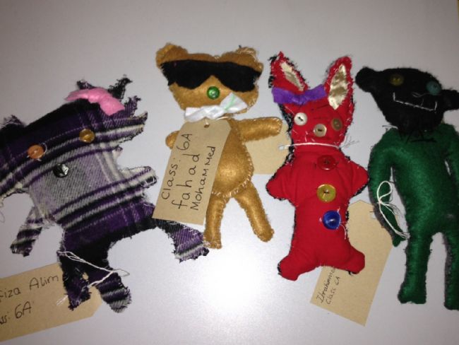 Four hand made teddies made from all different scraps of material, buttons etc.