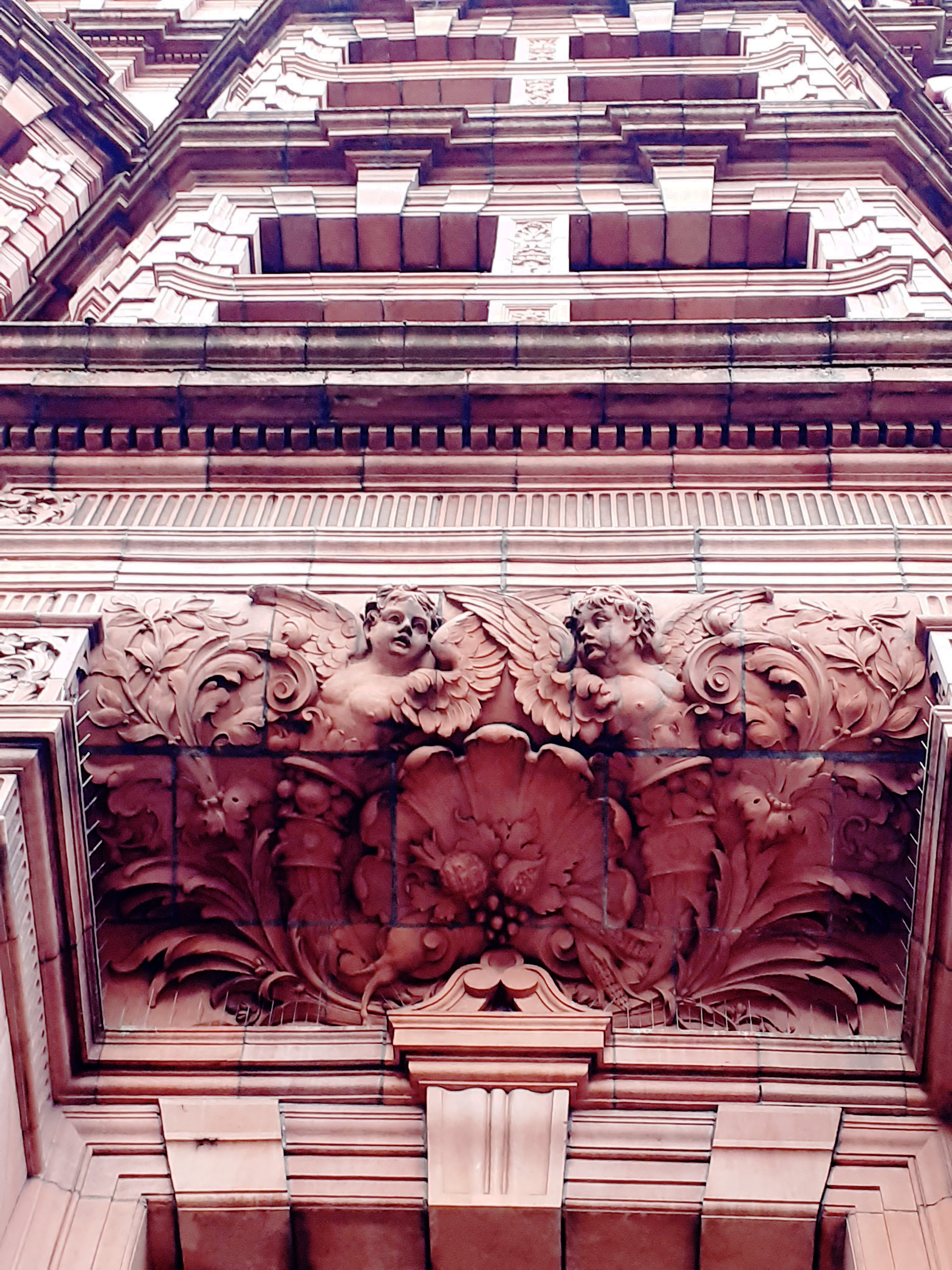 Close up of a part of the hotel, looking from the street upwards.