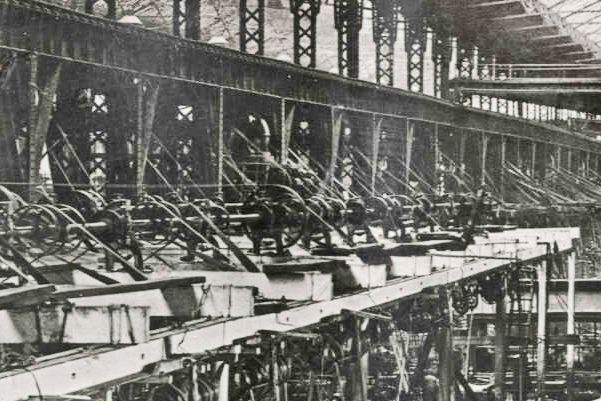 Black and white photograph showing rows of machinery in Dick, Kerr's & Co Munitions Factory