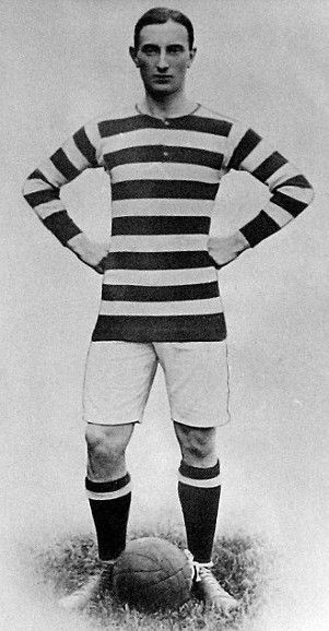 Black and white newspaper photo of Donald Simpson Bell in football kit.  His long-sleeved jersey is striped black and white, he wears white shorts and black socks.