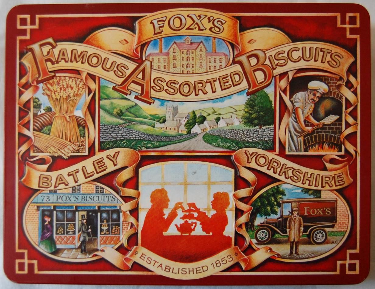Vintage tin of Fox's Famous Assorted Biscuits featuring nostalgic, highly colourful illustrations of a countryside, baker, and tea-time scene with a red border. Lettering proudly says 'Batley' 'Yorkshire' and 'Established 1853'.
