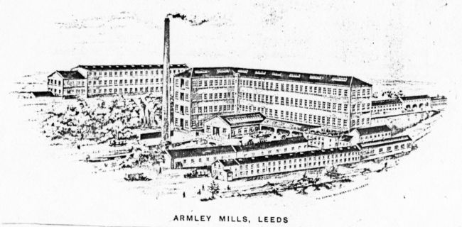 Etching of the extensive site of Armley Mills showing many long buildings with rows of windows and a chimney stack with smoke coming out.
