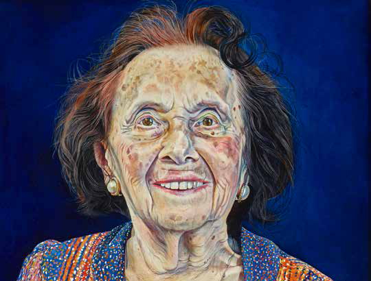 A detailed portrait of an elderly woman with short, wispy brown hair, smiling warmly. She wears a colorful patterned top and gold earrings, set against a deep blue background.