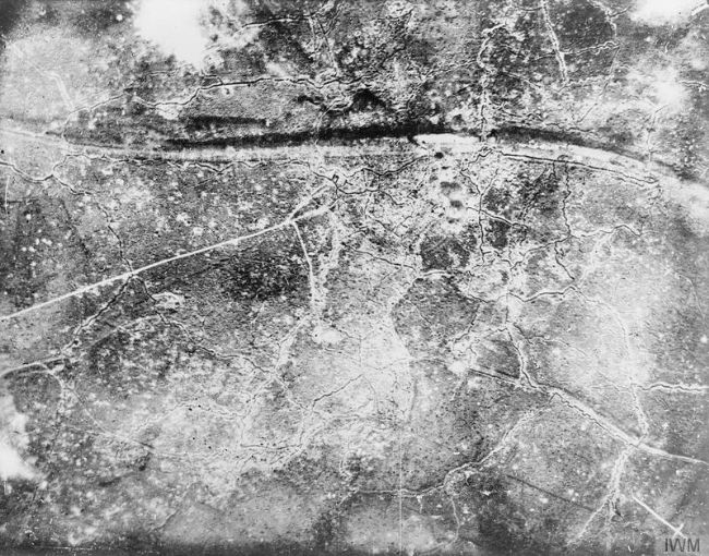 Black and white photograph taken from the air.  There are white lines and white splotches.