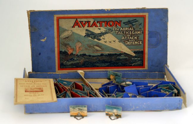 Board game with many card pieces.  The front of the box whows a plane highlighted by a searchlight, an airship an d some explosions.