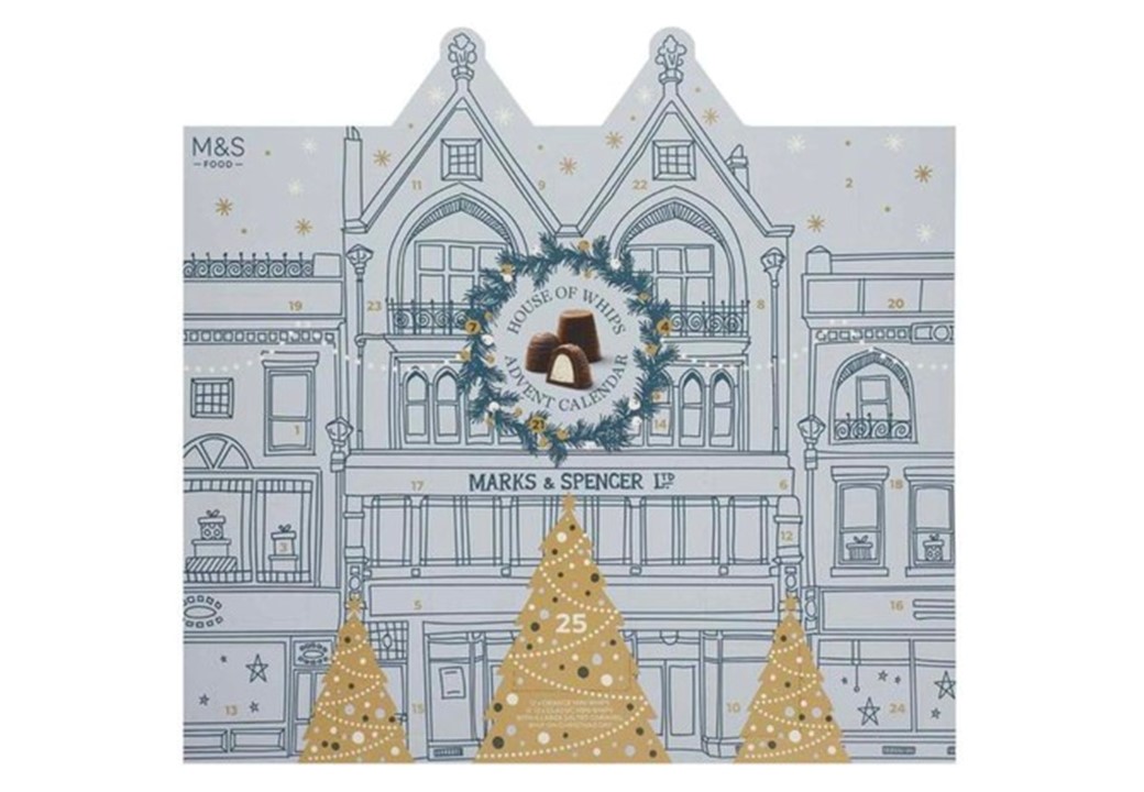 Marks & Spencer advent calendar, featuring a detailed illustration of a historic building with a festive wreath centrepiece and gold Christmas trees.