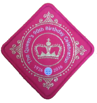 Pink diamond shaped Girl Guiding badge commemorating the Queen's 90th birthday celebrations in 2016