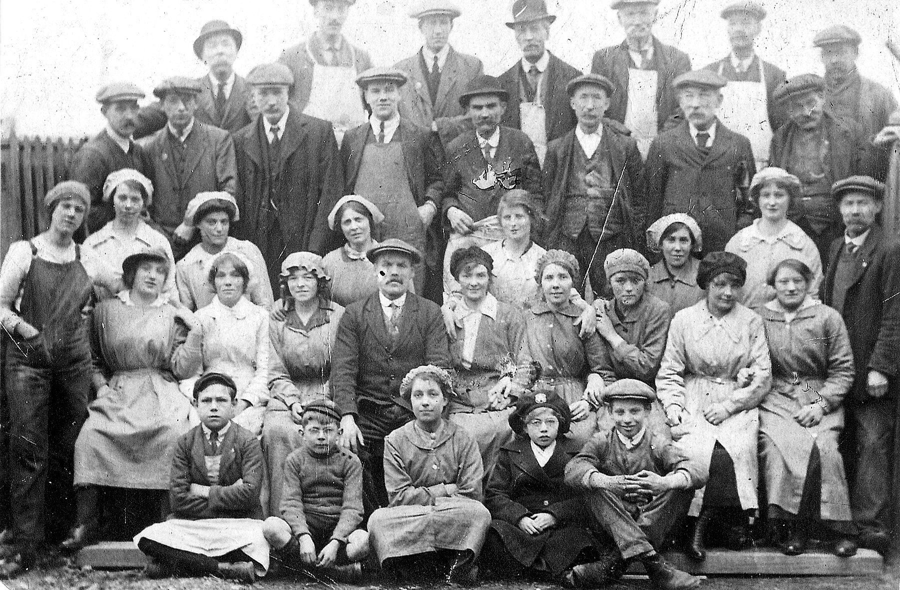 black and white photo of a group of male and female workers at Barnbow Munitions Factory, Leeds