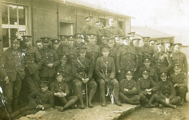 Informal group protrait of members of the 9th Battalian West Yorkshire regiment.  All are in army uniform.