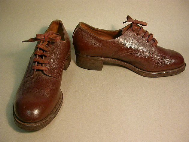 Mid brown leather lace-up shoes that look very sturdy.