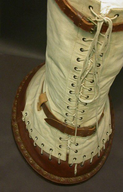 Back view shows how the lacing goes all the way up the boot and there are two leather buckles, one at the bottom and one at the top.