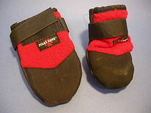 Black and red cloth boots that look like mittens.