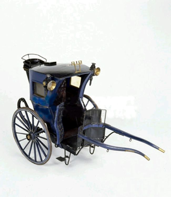 A later Hansom cab with driver's seat to the rear