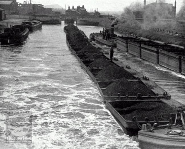 Two trains of Tom Puddings pass each other on the Aire and Calder Navigation canal