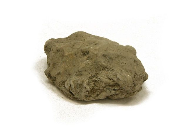 Lump of clay, grey bown in colour with rounded lumps and no sharp angles