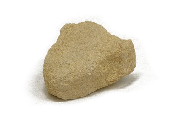 A chunk of sandstone. It is beige in colour and looks granular.