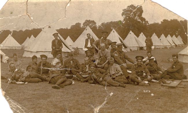 Photograph showing men from the East Riding Yeomanry relaxing in front of their tents