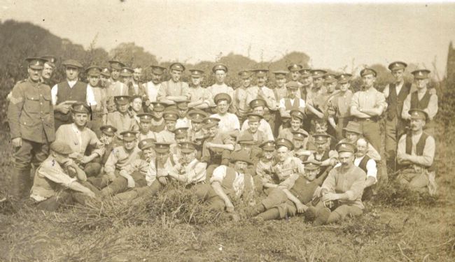Black and white photo of WW1 soldiers helping with the harvest at Fisher's farm, Cottingham