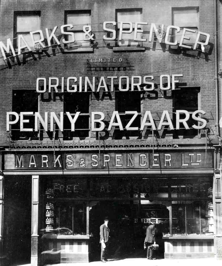 Early Marks & Spencer storefront with display windows and upper-floor signage.
