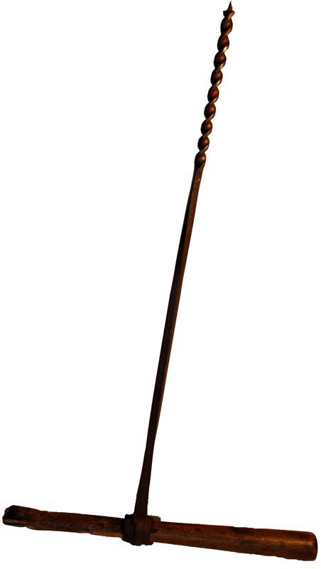 A hand drill. The metal drill is about 60cm long, with a wooden handle made from an old hammer handle.