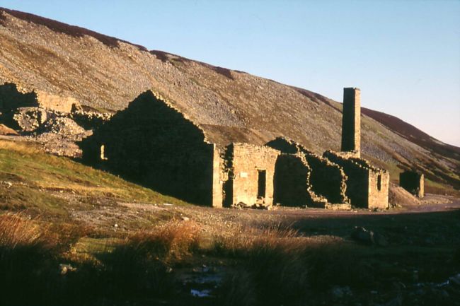 Ruined remains of a stone built Smelt Mill in wild moorland surroundings