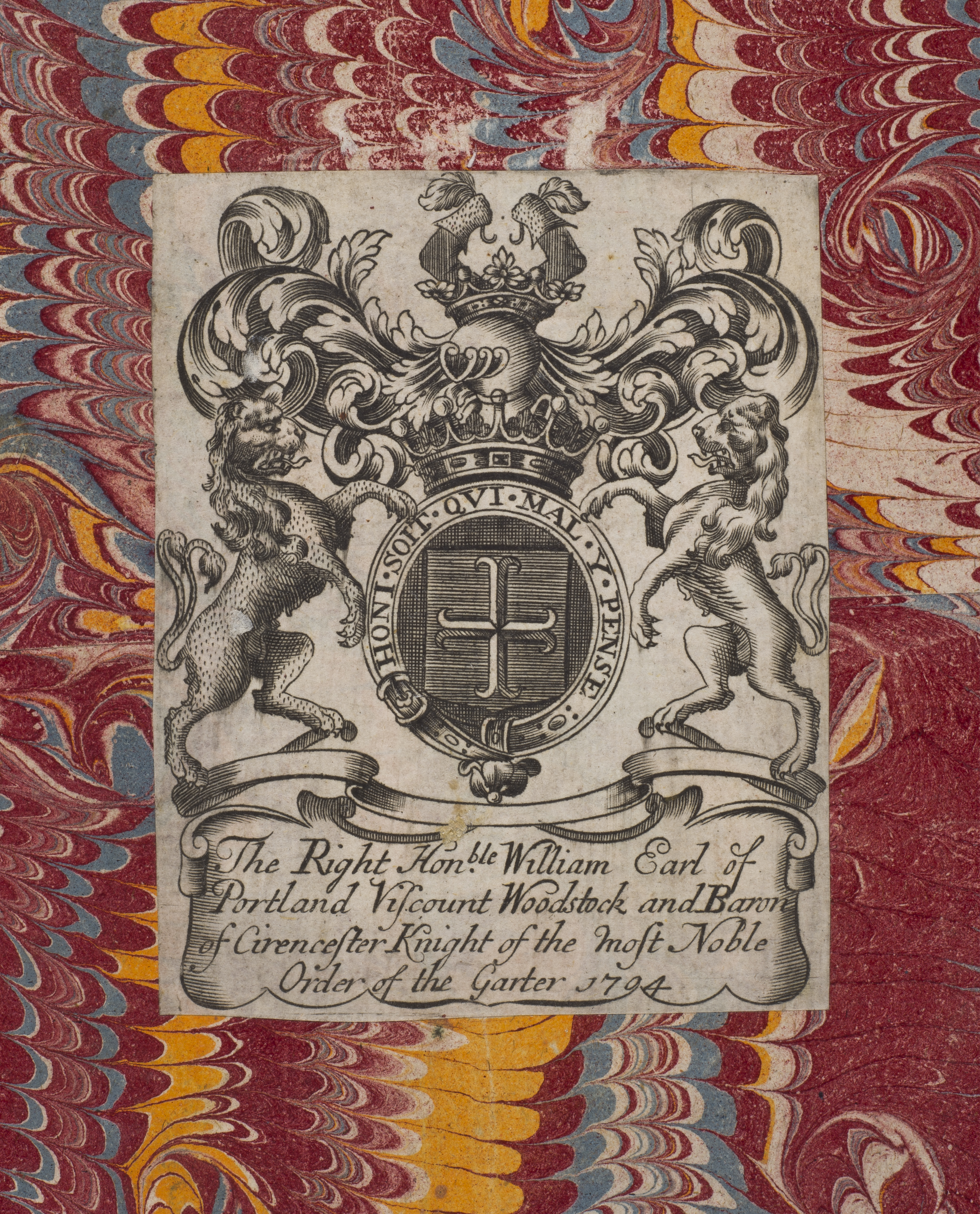 Close-up of a marbled page, with red, blue, yellow and white marbling