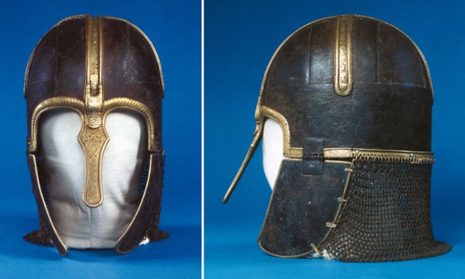 Front and side views of iron helmet with brass decorated strips running across the crown and chainmail neckguard