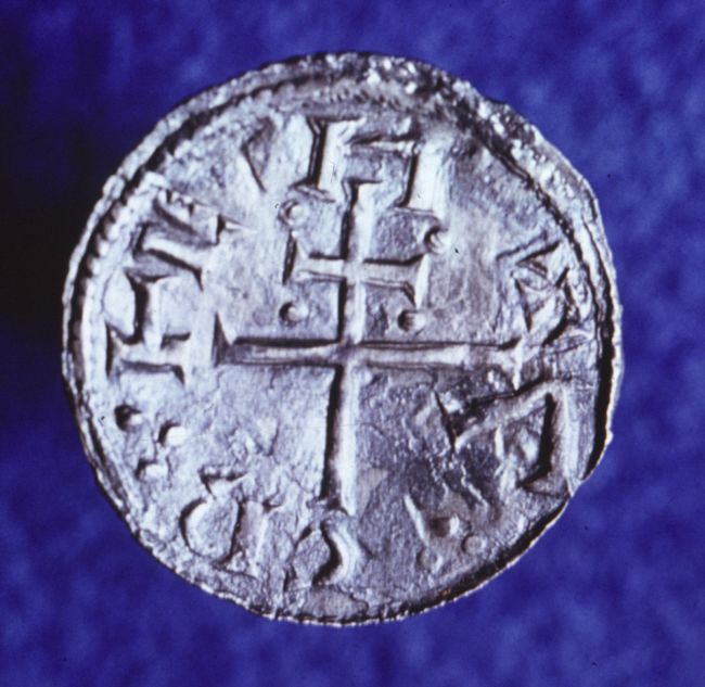 Silver coin marked with a cross symbol, known as a 'St Peter penny'