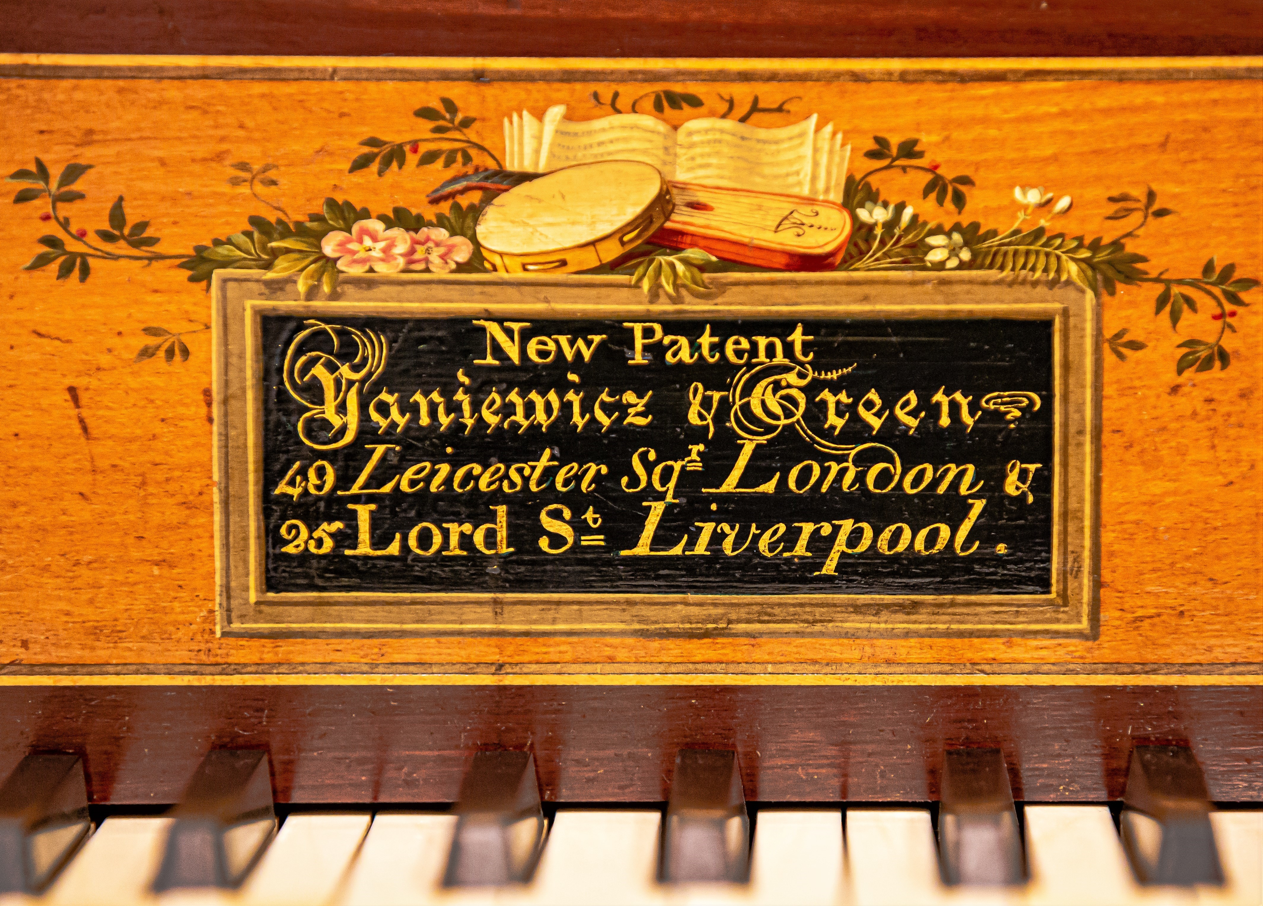 Gilt label from Yaniewicz & Green square piano with lettering ‘New Patent Yaniewicz & Green, 49 Leicester Square, London & 25 Lord Street, Liverpool.’